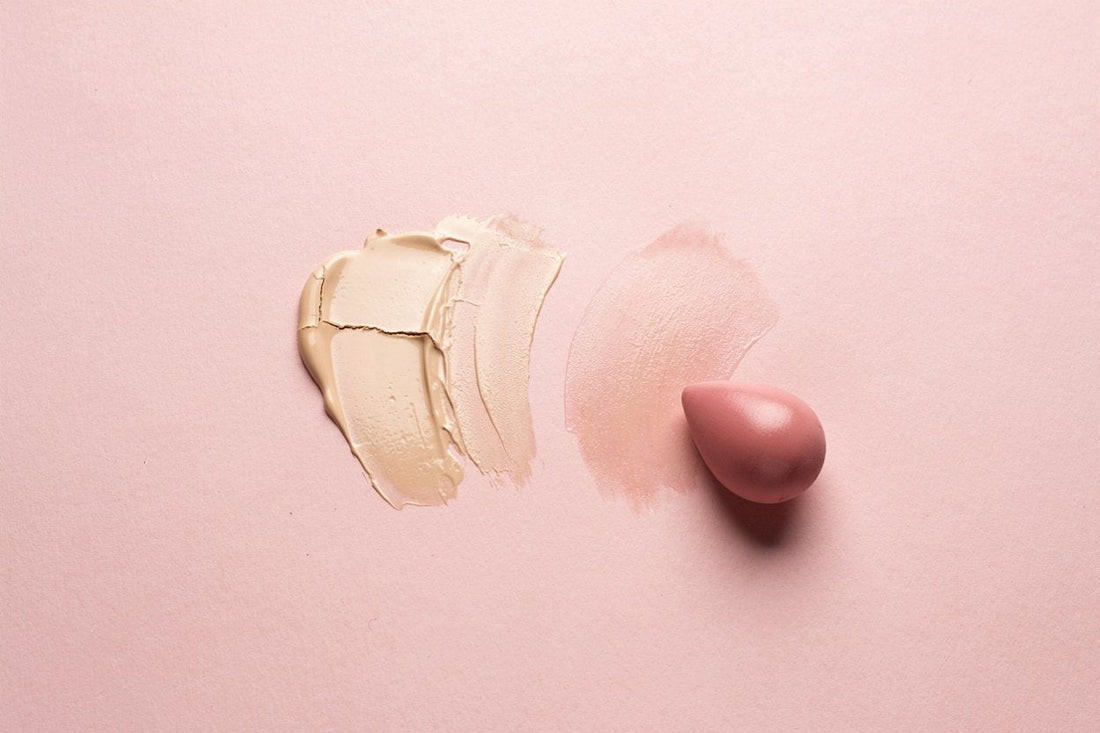 Cakey, cracked foundation swatch next to a smoothly blended swatch and a makeup sponge